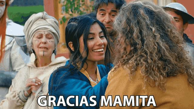 a group of people with the words gracias mamita on the top