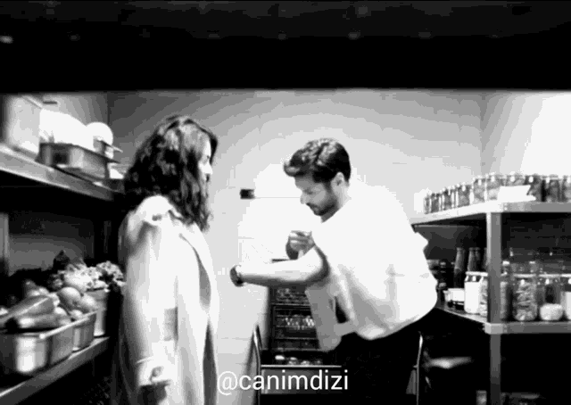 a black and white photo of a man and a woman with a caption that says @canimdizi