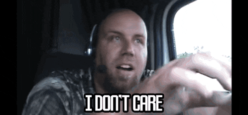 a bald man wearing a headset says i don t care