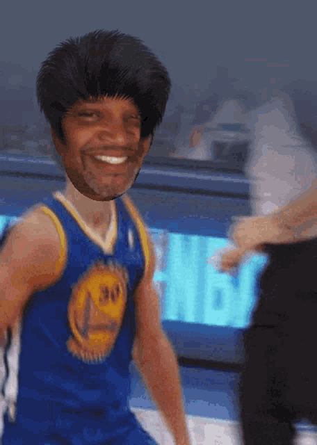 a man wearing a golden state warriors jersey smiles for the camera