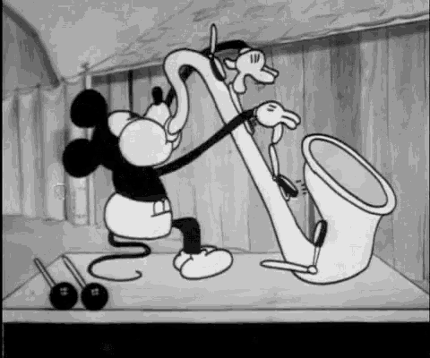 mickey mouse is playing a saxophone in a black and white cartoon