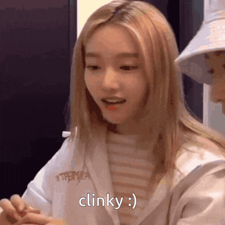 a close up of a woman 's face with the words clinky written on it