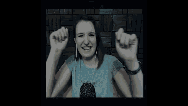 a woman wearing headphones and a t-shirt that says " never one " on it
