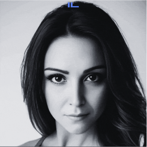 a woman 's face is shown in a black and white photo with a blue letter l above her head