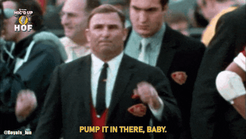 a man in a suit and tie is saying pump it in there baby
