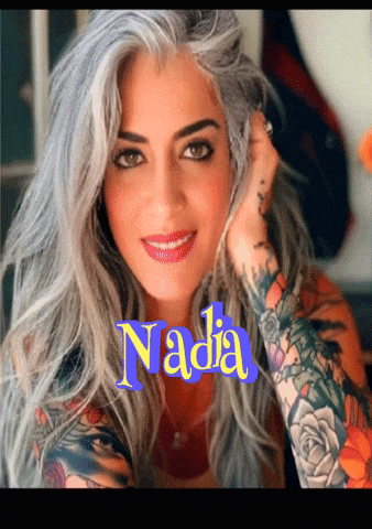 a woman with gray hair and tattoos has the name nadia on the bottom