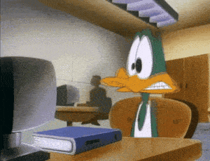 a cartoon duck is sitting at a desk with a binder on it