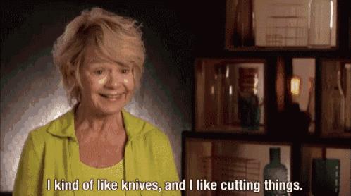 an older woman in a green jacket says i kind of like knives and i like cutting things