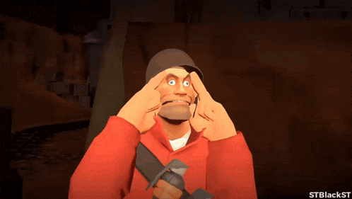 a man in a red jacket is holding a gun and making a face