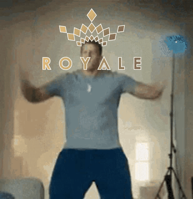 a man is dancing in front of a royale sign