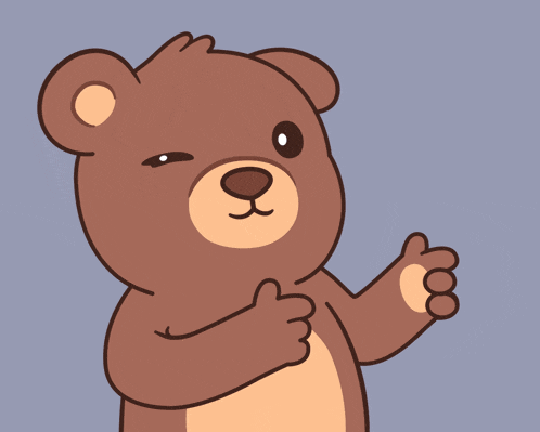 a brown teddy bear is holding a green object in his hand