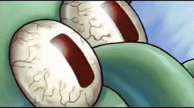 a close up of a cartoon character 's eyes with a red stripe in the middle