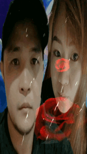 a man and a woman are posing for a picture with a rose in the middle of their faces