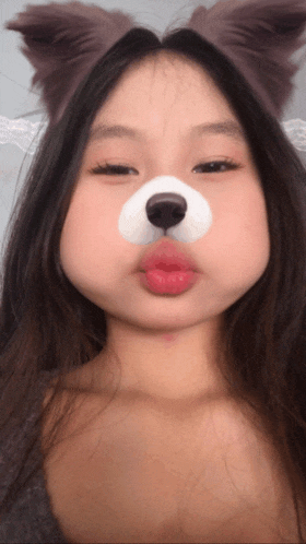 a girl with a dog face paint on her face