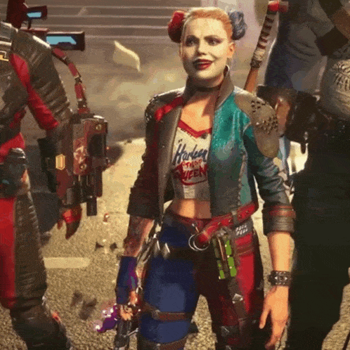 a woman in a harley quinn costume stands in front of two men