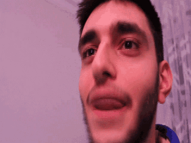 a man with braces on his teeth looks up at something