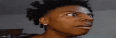 a close up of a person making a funny face with their mouth open .