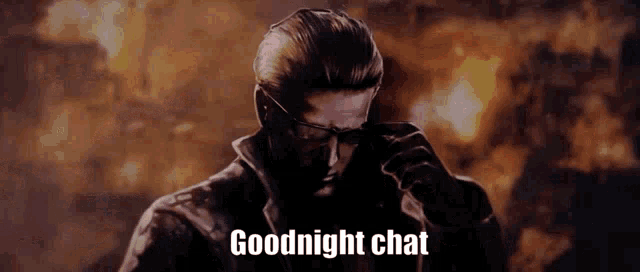 a man wearing glasses is standing in front of a fire with the words `` goodnight chat '' written on the bottom .