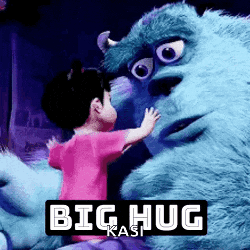 a little girl hugging a monster from monsters inc