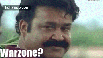 a man with a mustache is making a funny face and says warzone ?