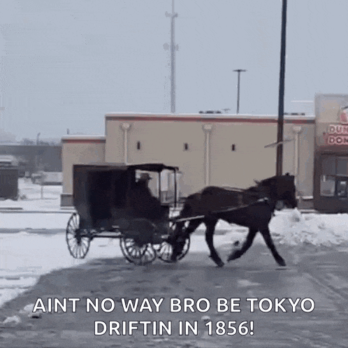 a horse drawn carriage is driving down a snowy road in front of a dunkin donuts .