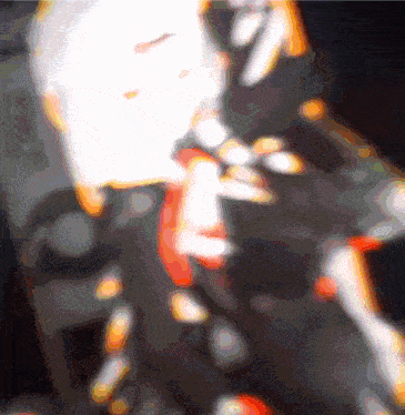a blurry picture of a person 's face with a white glow in the middle