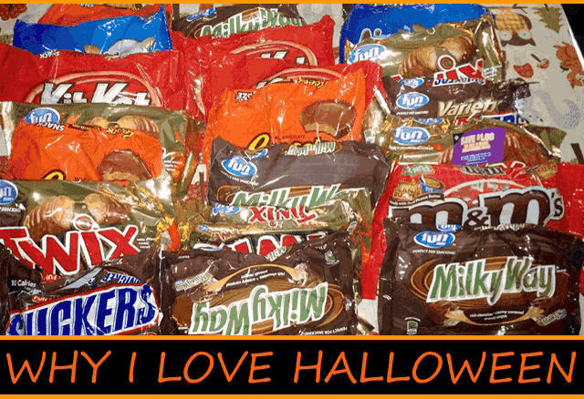 a bunch of halloween candy including snickers milky way and m&m 's