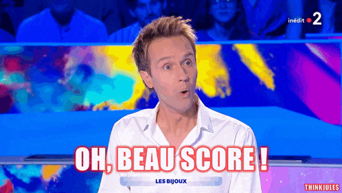 a man in a white shirt says oh beau score on a television screen