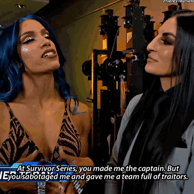 two women are standing next to each other and one of them is saying " at survivor series you made me the captain "
