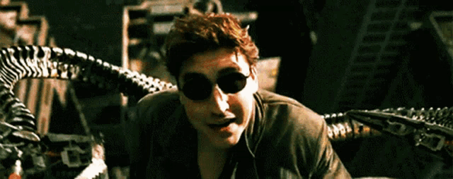 a man wearing sunglasses is surrounded by a monster