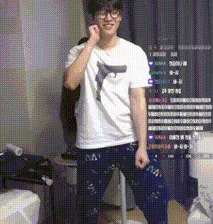 a man wearing glasses and a white t-shirt with a gun on it is dancing in a room .
