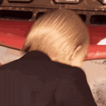 a close up of a man 's head with a red background