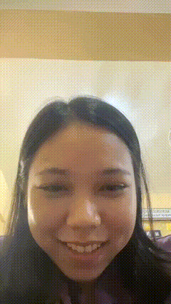 a close up of a woman 's face with a pixelated background