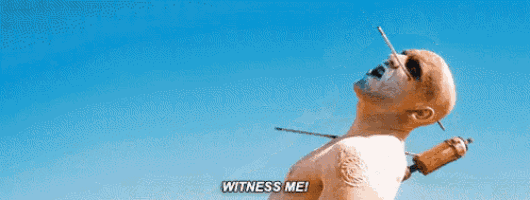 a man with a needle sticking out of his neck and the words `` witness me '' .