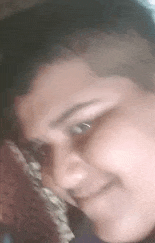a close up of a person 's face with their eyes closed .