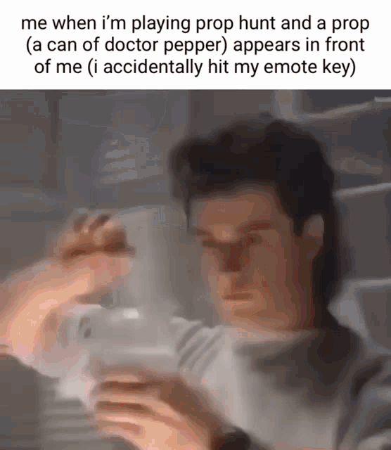 a blurry picture of a man playing prop hunt and a prop ( a can of doctor pepper ) appears in front of me