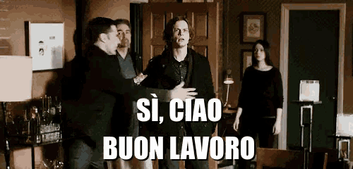 a group of people are standing in a room with the words si ciao buon lavoro on the bottom