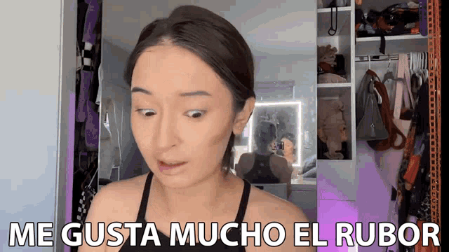 a woman says me gusta mucho el rubor in a closet