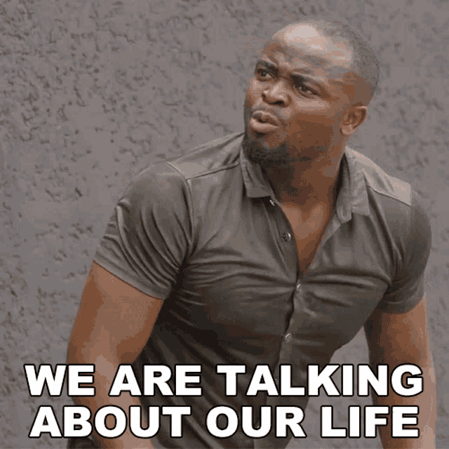 a man in a grey shirt is talking about his life