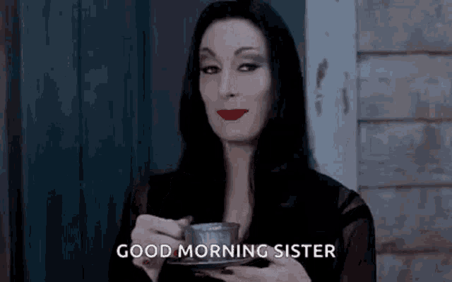 a woman in a costume is holding a cup of coffee and saying `` good morning sister '' .