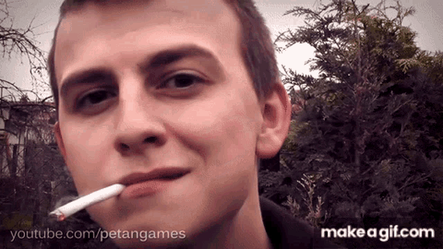 a young man is smoking a cigarette with youtube.com / petangames written on the bottom