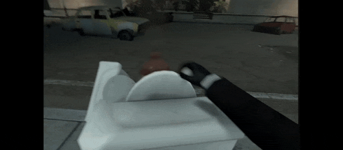 a video game scene with a person holding a container
