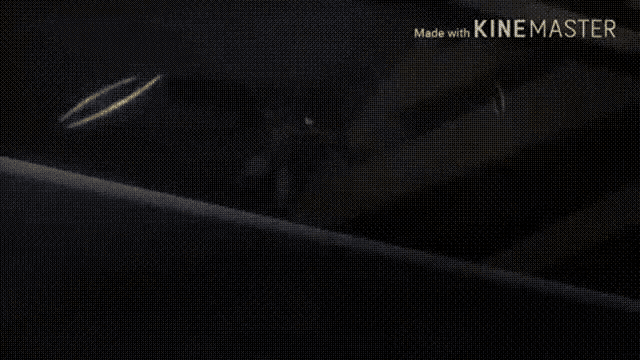 a close up of a person 's hand holding a fireball with the words made with kinemaster visible in the corner .