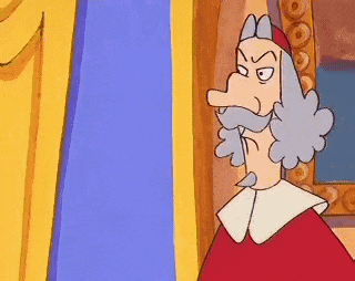a cartoon character with a long nose and beard is standing in front of a yellow wall .