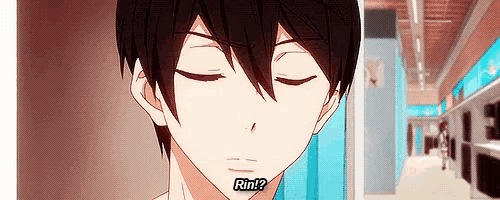 a close up of a person 's face with their eyes closed and the words `` rin '' written on it .