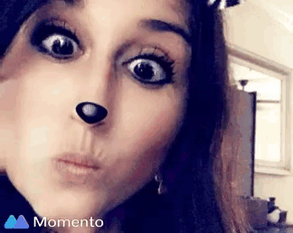 a close up of a woman 's face with a dog 's nose .