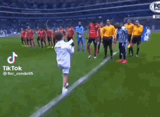 soccer players on a field with a tiktok watermark on the bottom right