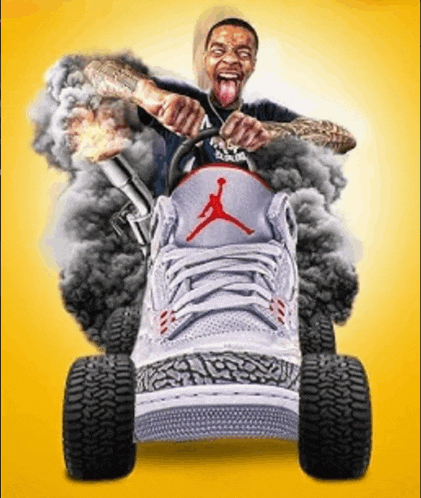 a man is driving a shoe with smoke coming out of the tires