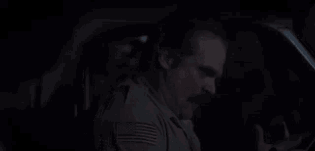a man with a mustache is sitting in a car with a caption that says there 's nothin wrong with nana !