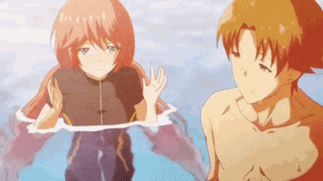 a boy and a girl are standing in a pool of water .